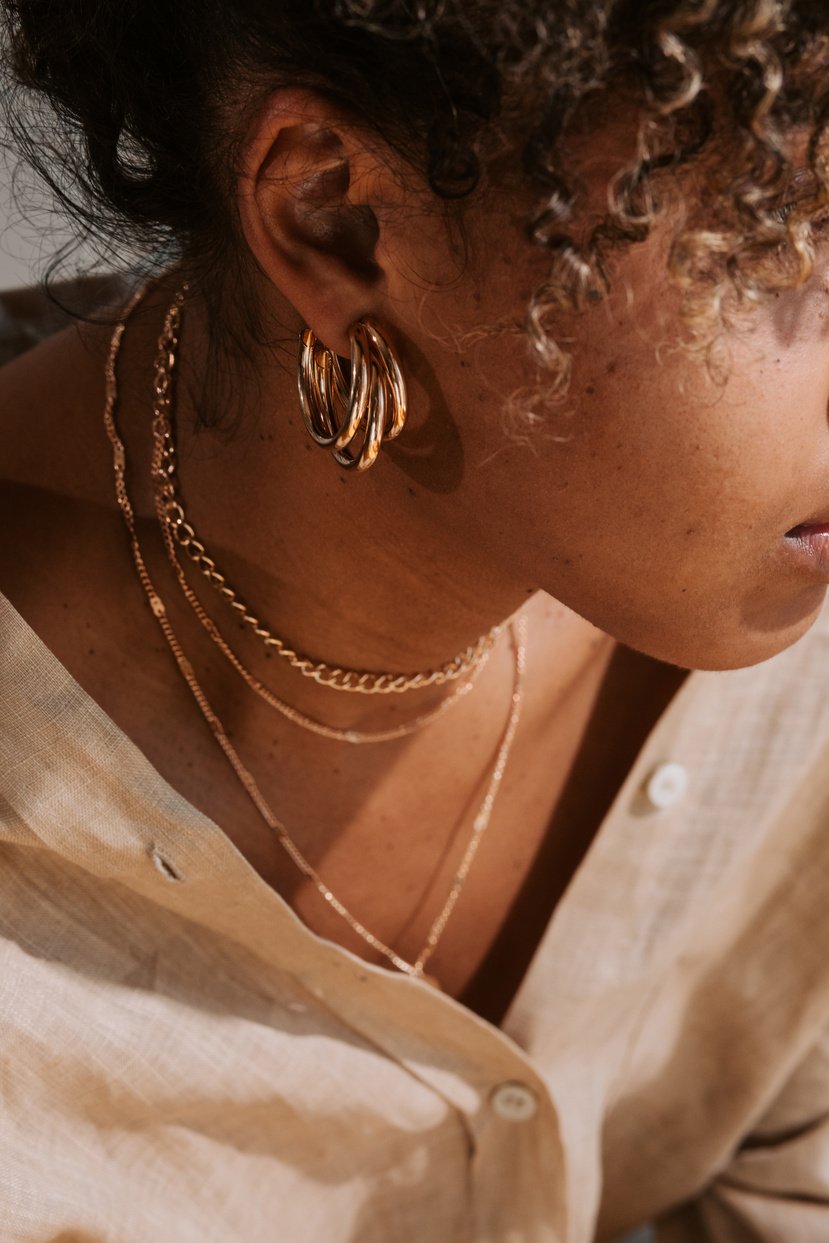 Woman Wearing Gold Jewelry