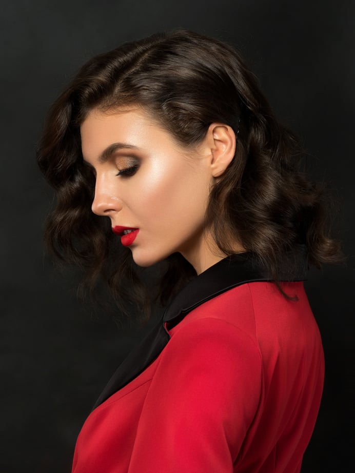 Portrait of Young Woman in Red Suit